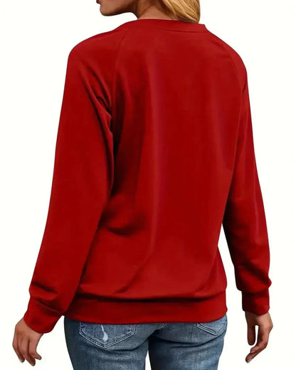 Womens christmas sweater with Merry Christmas slogan, reindeer print and ribbed hem