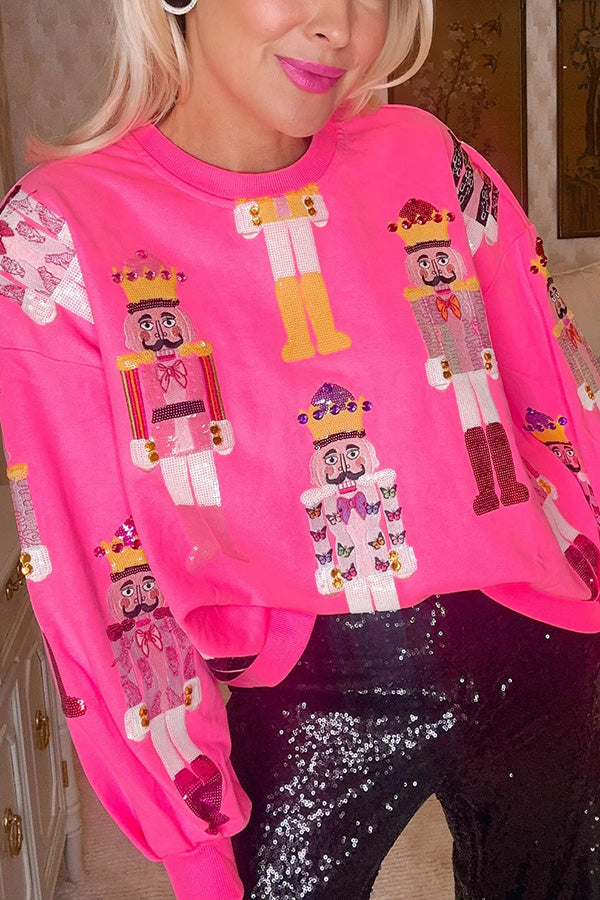 Womens Christmas sweater with sequin nutcracker design, loose fit crew neck