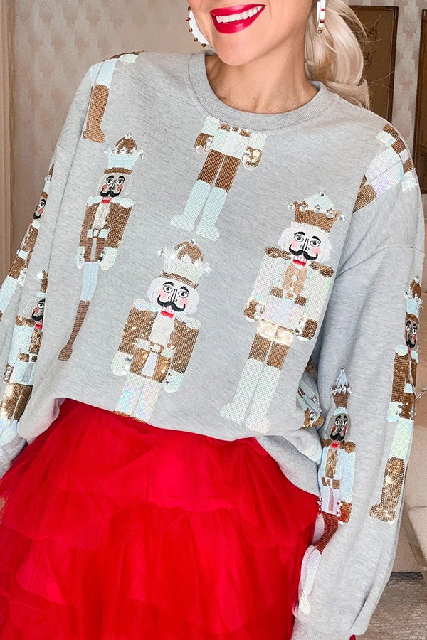 Womens Christmas sweater with sequin nutcracker design, loose fit crew neck