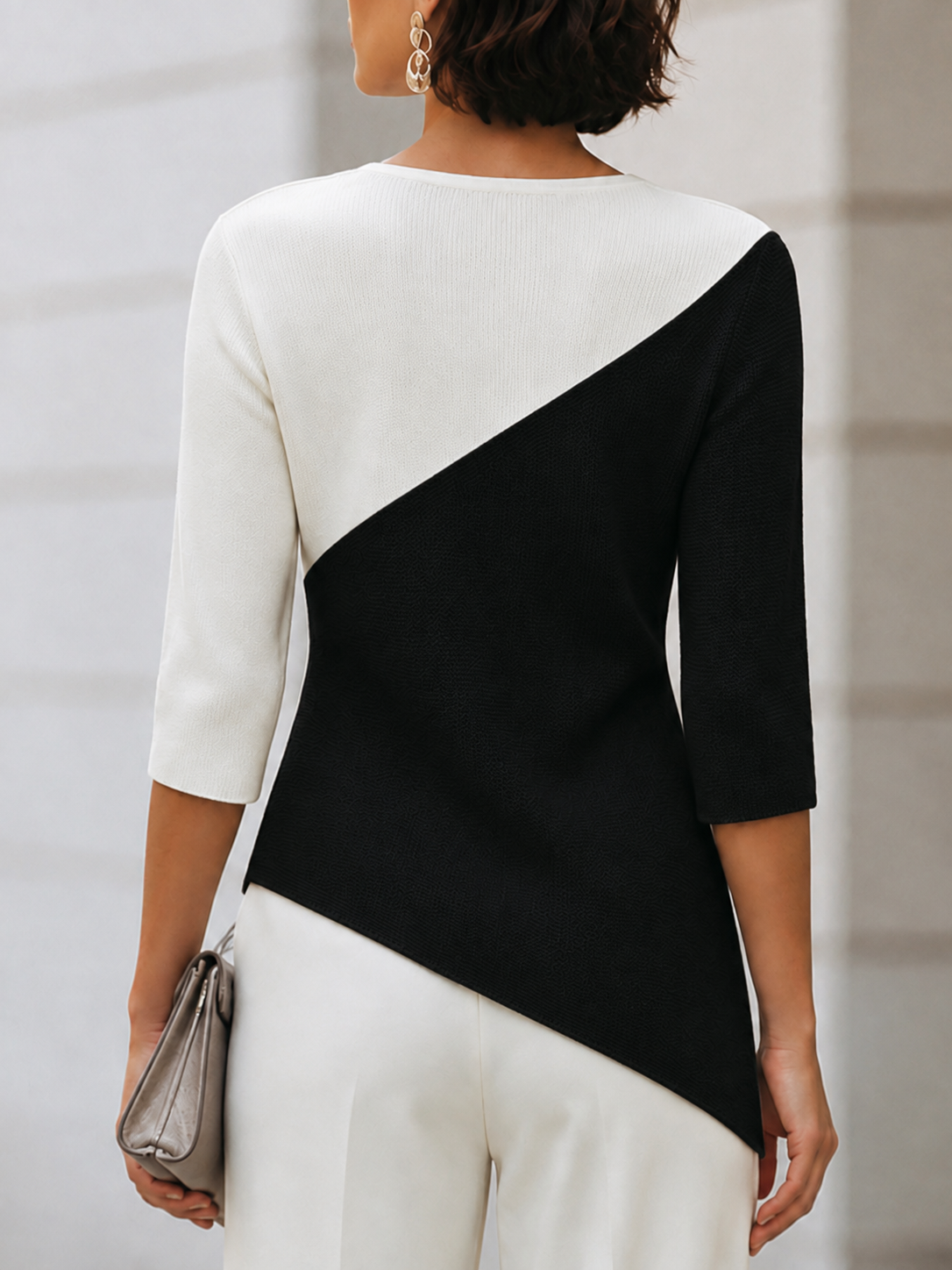 Women's sweaters with 3/4 sleeves, crew neck and asymmetric hem