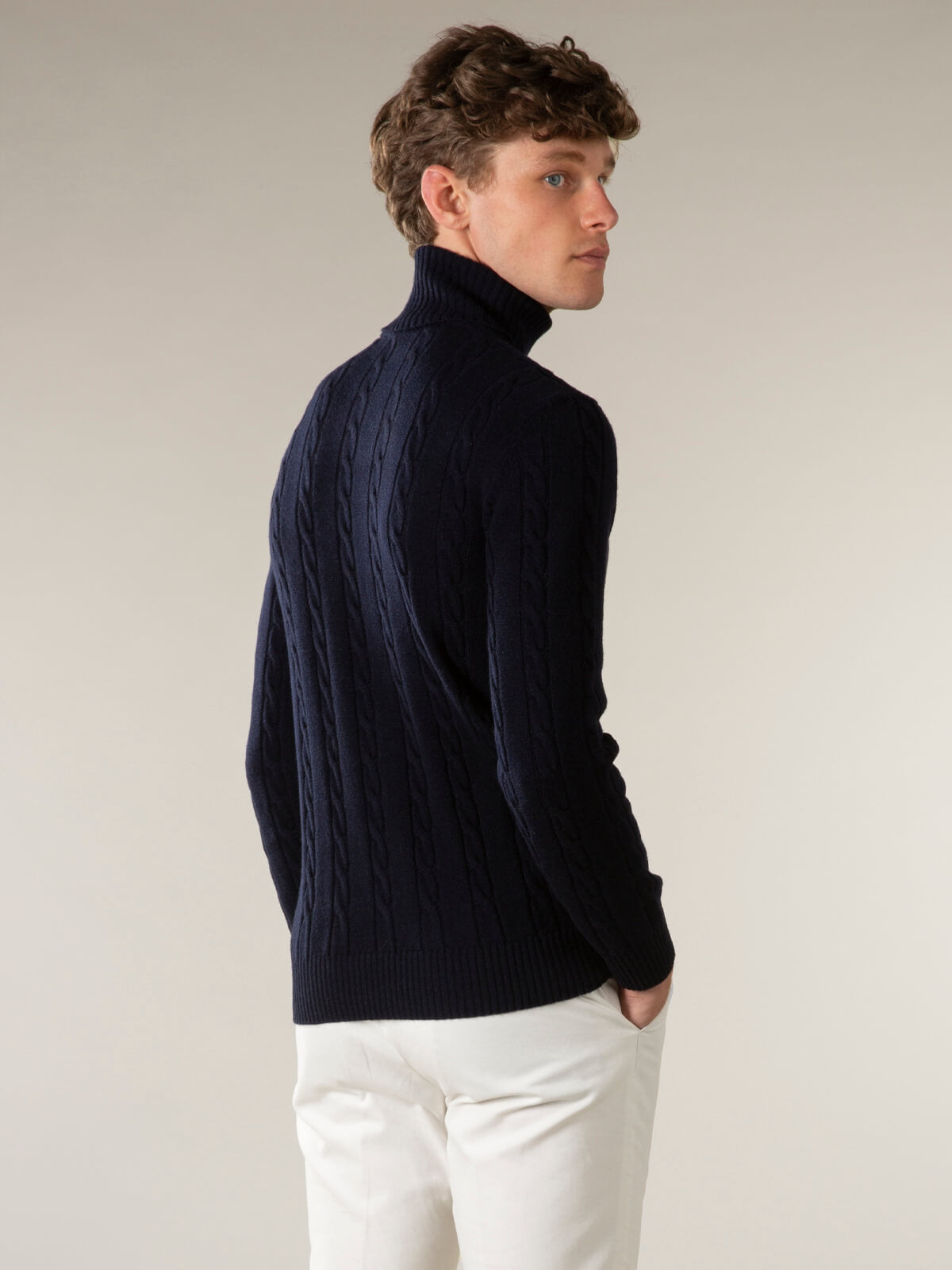 Men's cable knit turtleneck sweater with long sleeves and ribbed trim