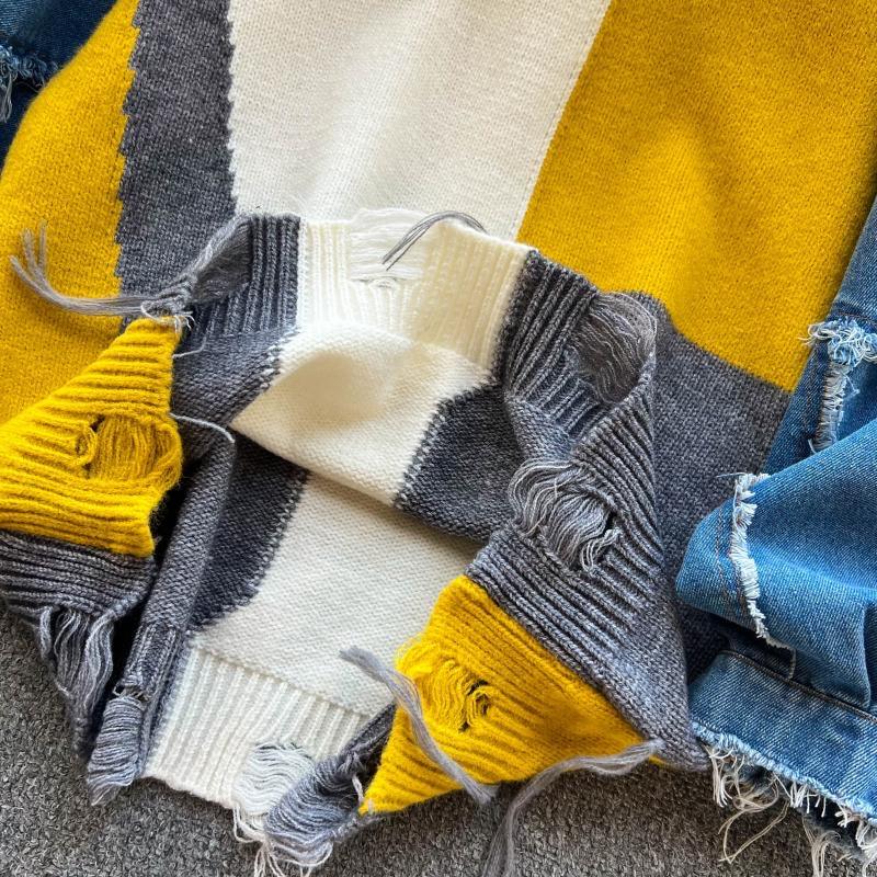 Women's sweaters with denim sleeves and a distressed hem