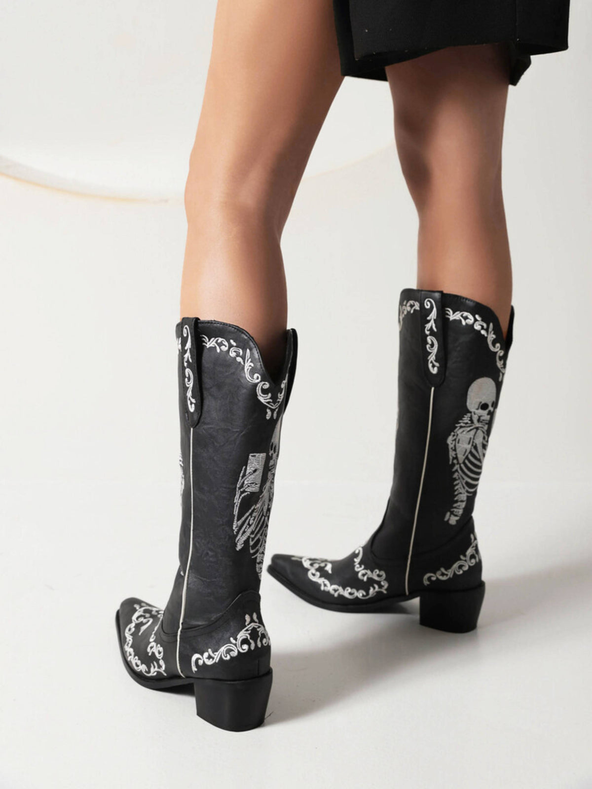 Knee high cowboy boots for women with skeleton embroidery and pull-on design