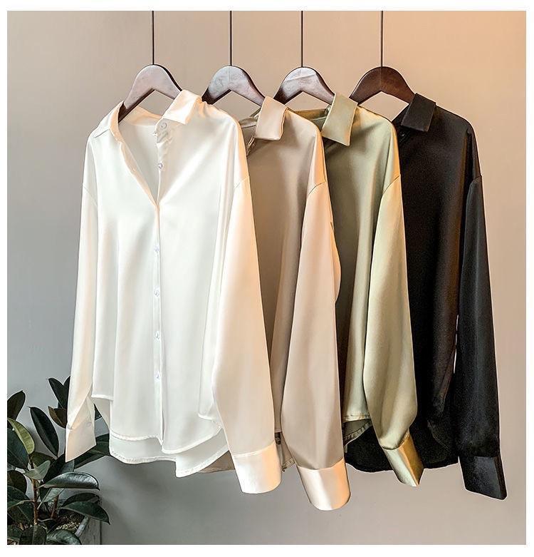 Oversized shirts for women with pointed collar, button down front and curved high low hem
