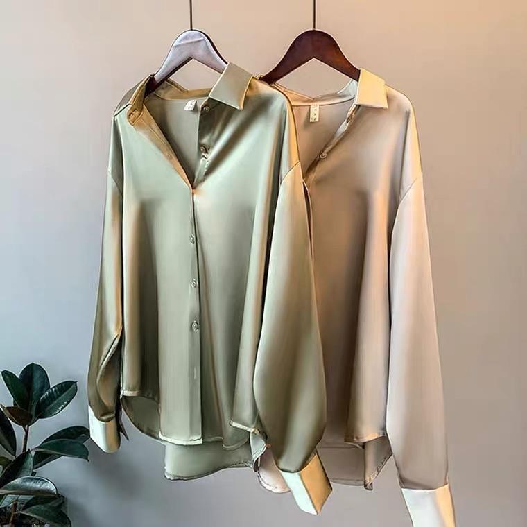 Oversized shirts for women with pointed collar, button down front and curved high low hem