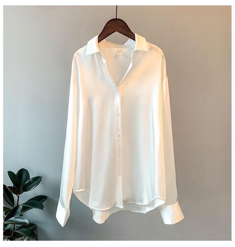 Oversized shirts for women with pointed collar, button down front and curved high low hem