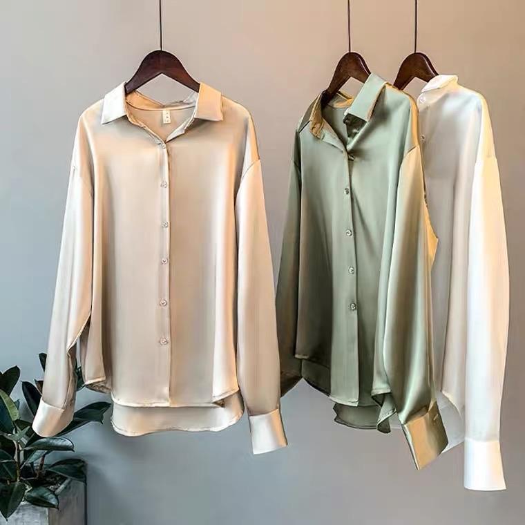 Oversized shirts for women with pointed collar, button down front and curved high low hem