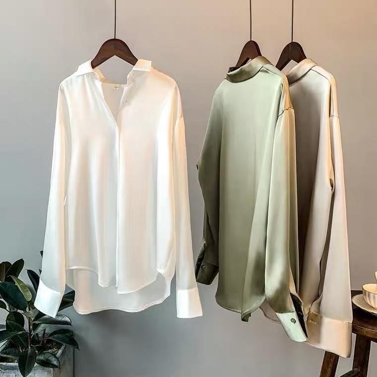 Oversized shirts for women with pointed collar, button down front and curved high low hem