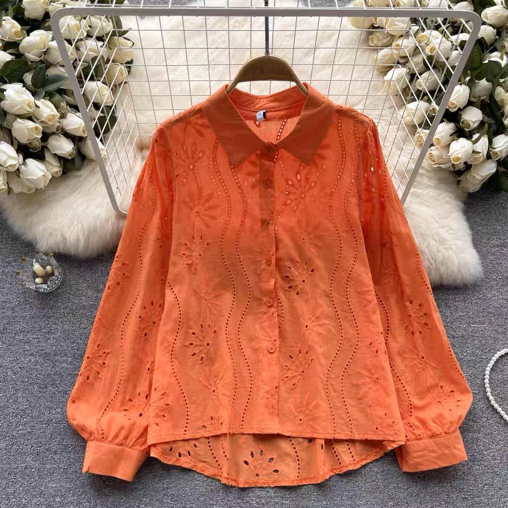 Eyelet shirts for women with button down front, relaxed fit and curved high low hem