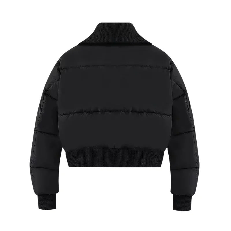 Womens puffer jacket with high collar, zip pockets and ribbed trims