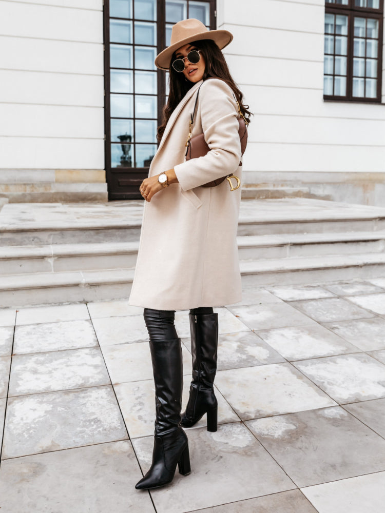 Single breasted long coat for women with notch lapel and flap pockets