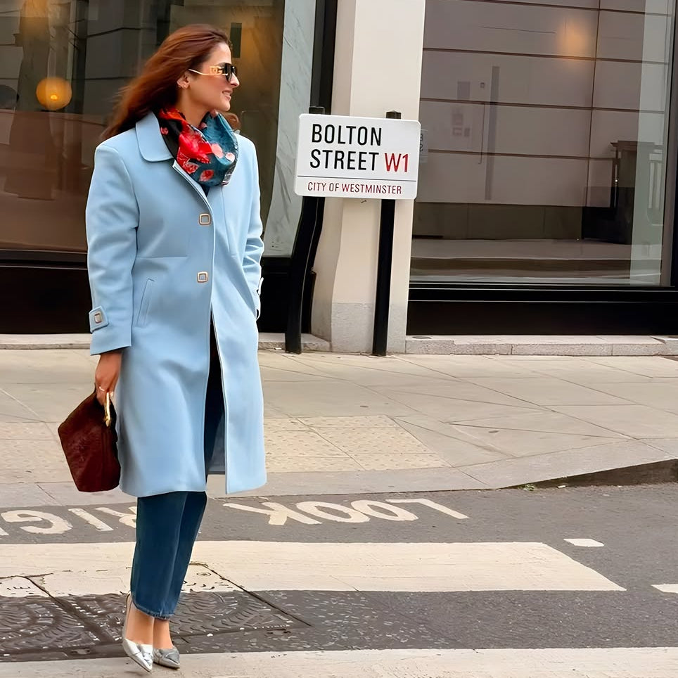 Long single breasted coat for women with waist seam and flared A-line shape
