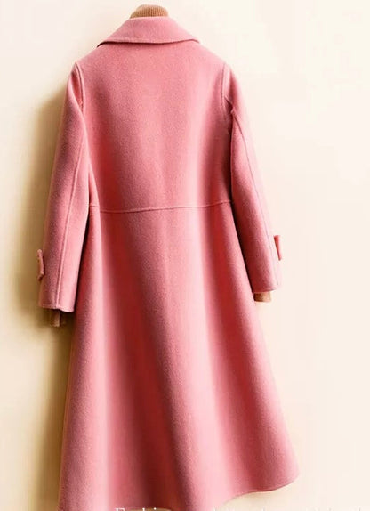 Long single breasted coat for women with waist seam and flared A-line shape