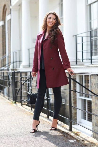 Trench coat for women with double breasted front and belted waist