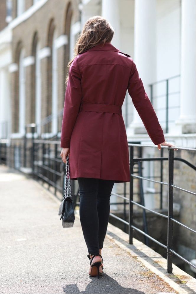 Trench coat for women with double breasted front and belted waist