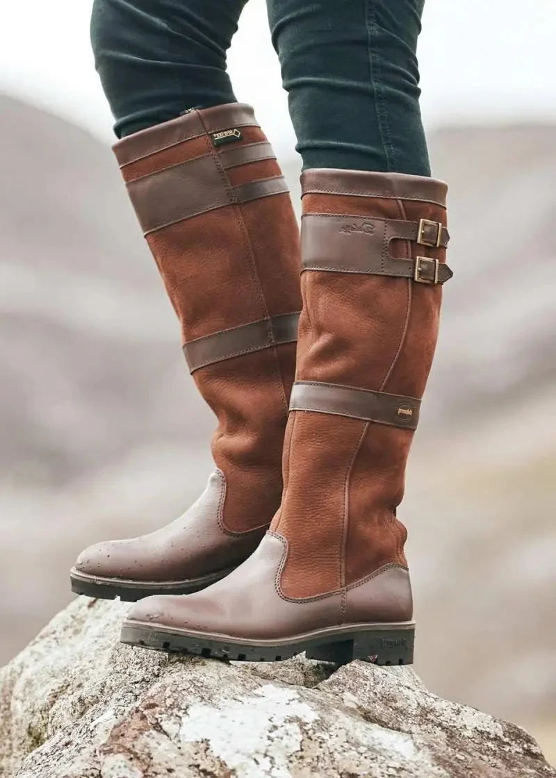 Knee high boots for women with double buckle straps, panelled upper and round toe